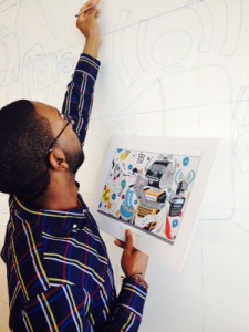 A SCAD student sketches his design on the wall of Newell Rubbermaid's new Sharpie(R) brand headquarters, which will become part of permanent art installation. 